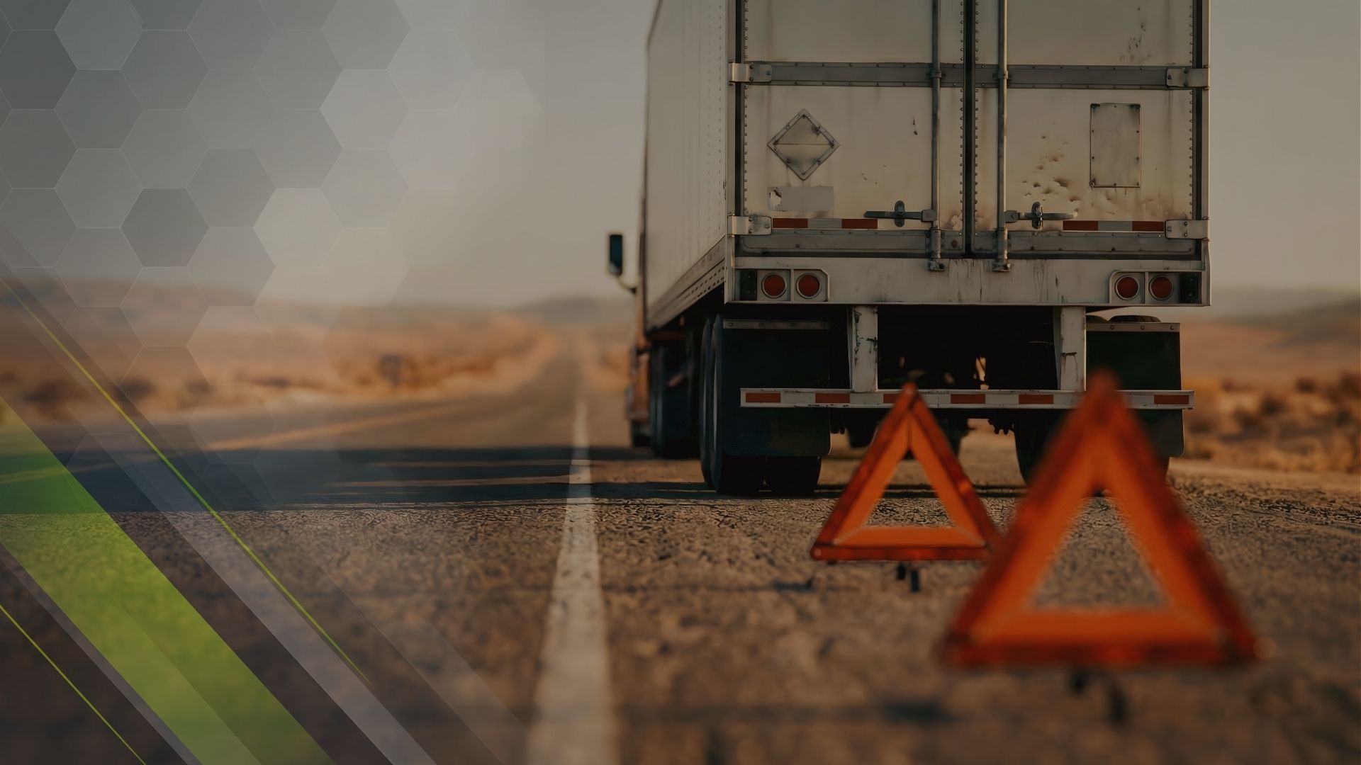 Commercial truck stopped beside the road with a warning triangle